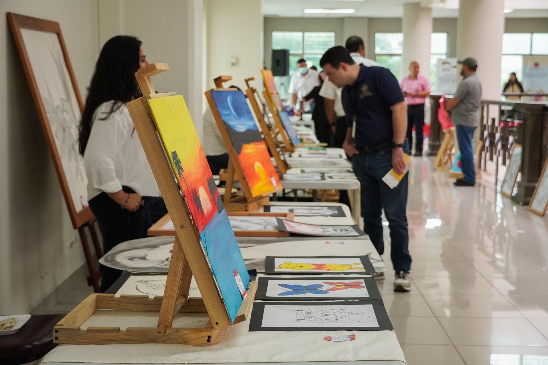 Youth artwork displayed at Esencia Creativa Expo Fair